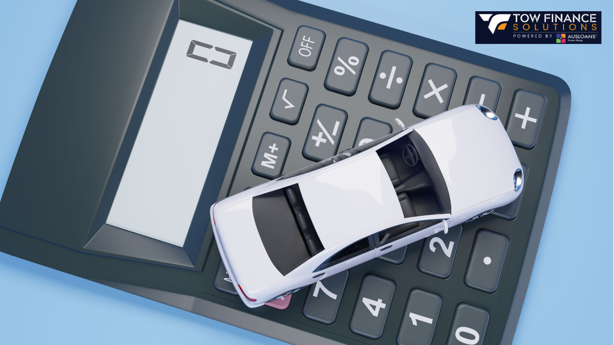 car miniature on top of a calculator
